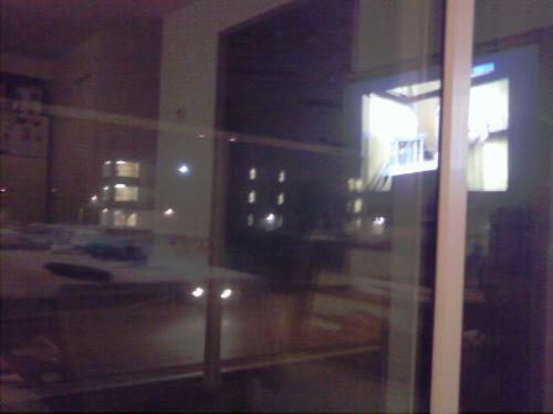 Does anyone else see a faint person in the reflect - It's a picture of my balcony through the balcony window (from the couch). I was playing with my phone. Then when I zoomed in (I'd just realized my phone had a zoom lol), it looked like the bust of a person in the reflection. It's to the left, and slightly below the reflection of the tv (which is obvious).   I wasn't exactly watching anything spooky, either. You can see the reflection of some Discovery Channel type thing in the tv...