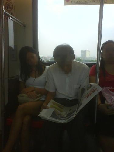 free newspaper reading - FREE NEWSPAPER READING 
Reading of newspaper by peeping over the shoulder of the person sits next to you is common scene in train or buses. The photo was snapped in a train ride to the city.