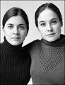 sisters - Two girls, sisters that look very much alike.