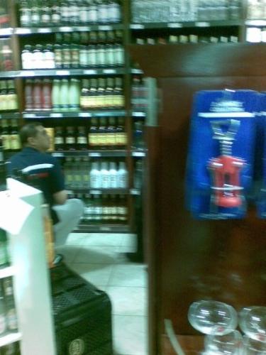 Cong. Mikey Arroyo buying alcohol at Rustans durin - Cong. Mikey Arroyo was seen buying bottles of alcohol beverages during the height of Typhoon Ondoy at Rustan's Wine Section. Is he aware of the aftermath brought by the typhoon, with lots of people drowned and homeless?