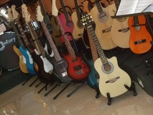 guitars - range of guitars for sale at a mall.