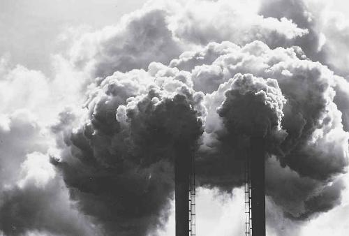 Pollution - Pollution from industries. Smokes coming out from the chimneys.