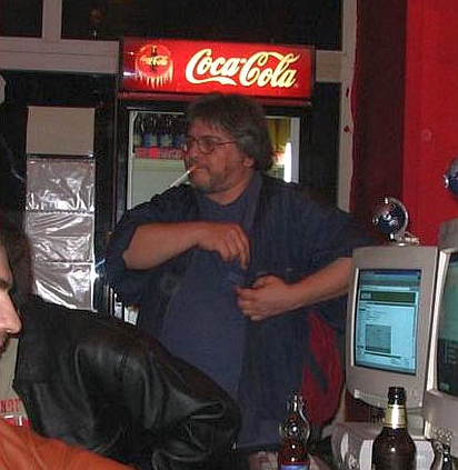 me at work preparing to smoke - Me, checking for my lighter. Seconds later I start smoking that LM long cigarette. Picture taken where I work (internet cafe), on a 31 march, late night (very important date in Earth history - my BD).