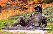 Statue of Rip Van Winkle - 'Rip Van Winkle' is a short story by the American Author Washington Irving published in 1819. The story of Rip Van Winkle is set in the years before and after the American Revolutionary War. Rip Van Winkle, a villager of Dutch descent lives in a nice village at the foot of New York's Catskill Mountains.An amiable man whose home and farm suffer from his lazy neglect,he is loved by all but his wife.  One autumn day he escapes his nagging wife by wandering up the mountains.There he encounters strangely dressed man who are playing nine-pins. After drinking some of the wine,he settles down under a shady tree and falls asleep. He wakes and returns to his village,where he finds twenty years have passed. He finds out that his wife has died and that and his close friends have died in a war gone somewhere else. He proclaims himself loyal subject of Kin\g George 111,not knowing the American Revolution has taken place.