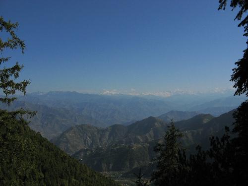 Mountain view - Mountains --awe inspiring. This is a distant shot of the Himalayan range and you can see the snowpeaks at a distance.