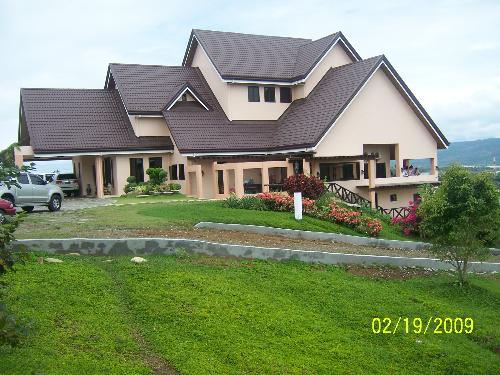 a house on the hill - a nice constructed house on the hill with a wide beautiful green landscape
