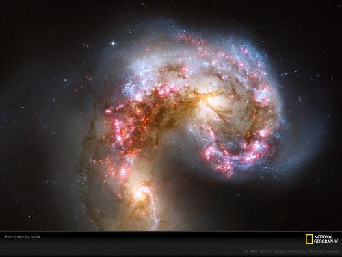 Galaxies - this is picture of Antennae Galaxy, photographed by NASA and available on National Geographic website. A lot many others are available too. this is just a portion of our Universe. Just think how many aliens might be there!