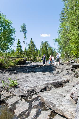 Another part of the metor crater - Some American tourist w/family, and two young local tour guides showing them around.