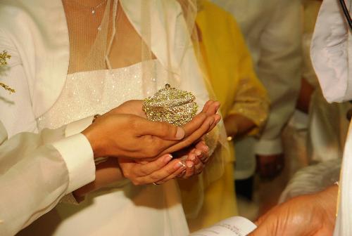 Arrhae ceremony - The picture shows the groom passing the arrhae to the bride