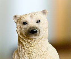 Polar Bear figurine - Photo showing the upper body part and head of a Polar Bear figurine, taken with a Nikon D80 DSLR and kit 18-135mm lens, resized down quite a bit.