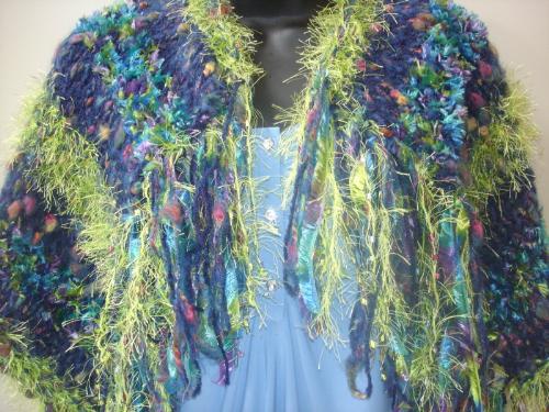Hand Knitted Shawl - The Monet's Garden Hand Knitted Shawl is made with various textures of yarn, in shades of royal blue and lime green.