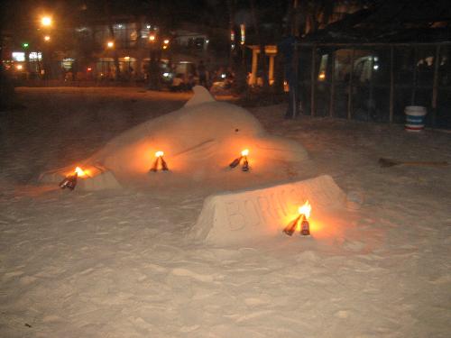 sand carvings - The famous sand castles ( or in this case sand dolphin ) of Boracay, every night, a new one is made so the tourists could take a picture and voluntarily give some tip to the one who made it.