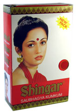 Bindi or Bottu to be kept on forehead - Maroon colour bindi on forehead image