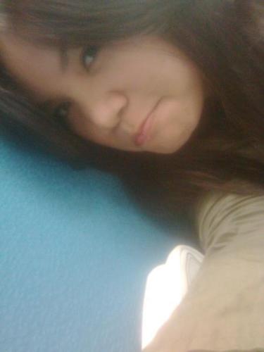 that's me! - this photo was taken while I'm on break... :P Kinda look sad cause i missed my hometown.. huhu