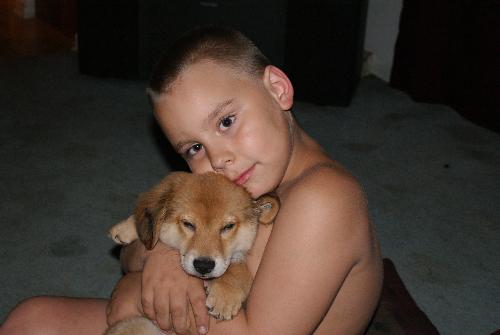 nephew and puppy - This is my nephew with his new puppy.