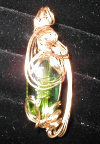 lucky wire art - made as one of my first jewelry pendant. Gold wire with beautiful see through green stone. I call it lucky mainly because It was admired by many and it turned out prettier than thought. I made this at home in seach of wanting to learn more about wire art and I continued makeing more and more and then earrings and rings now I am enjoying shareing it with others. Hope you like it to.
