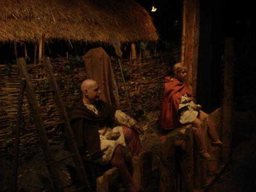 Jorvik Viking Centre view - At the end of your journey back in time there is an open pod-type contraption waiting for you, which will take you on a ride through the streets of Jorvik. Every pod has 2 rows of seats holding up to 6 people. You can push a button in front of your seat to choose an appropriate language to listen to a commentary about what you see.  Slowly you will pass by two children, who are playing a popular Viking board game called Hnefetafl. Then you will come across the blacksmith's home, an example of an old, simpler, single storey building made from wattle and daub, which suffered from severe dampness. Next you pass the woodturner's home, a brand new cellared building made entirely from oak. Don’t be surprised when the speakers by your ears become rowdy because you are just encountering the woodturner at work as well as an afternoon chat between two men and a woman. The woman is their neighbour in the opposite street and just leans over on her wall.
