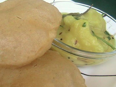 puri - Puri is one of the famous South Indian breakfast item served with potato curry as side dish.