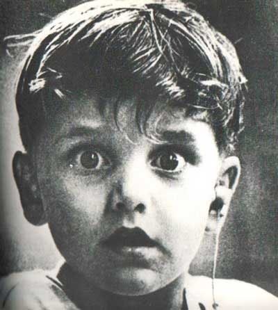 A Boy - A Boy with a suprised expressio on his face because it is actuallly the first time he is hearing anything.