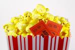 Movies - A bag of popcorn with movie tickets poking out of the sides