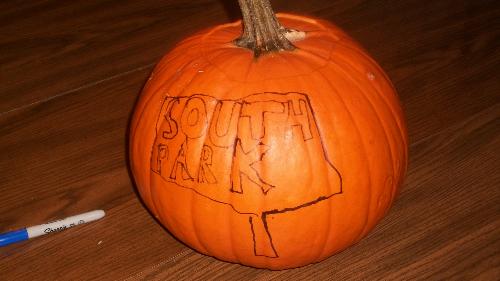 Pumpkin about to be carved - The pumpkin has the face drawn on it but has not yet been carved.