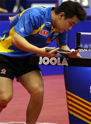 Table Tennis - Wang Hao (World Number 1) prepares to serve.