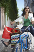 Living Life - Living life with gay abandon is what this image depicts. A lady on a bike is sure a pretty image to depict living life.