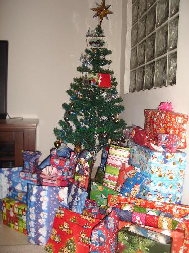 Gifts underneath the Christmas Tree - A skinny Christmas tree with more than 50 gifts during last year&#039;s Christmas...