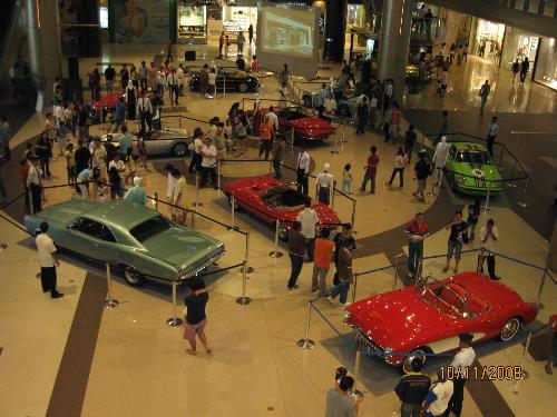 enjoying life - enjoying vintage cars show in a mall