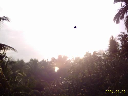 A dot in the sky - This picture was taken from my terrace and I still cannot understand where that dot has come from!!