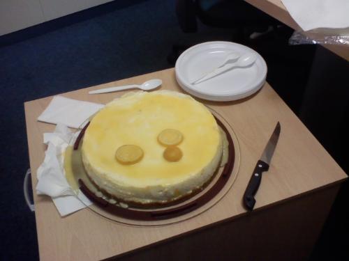Cheesecake - A cheesecake topped with lemon.