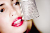 voice lending - This lady looks confident while speaking on the microphone