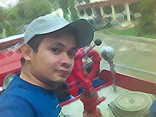 Me - This is me on top of a fire truck.