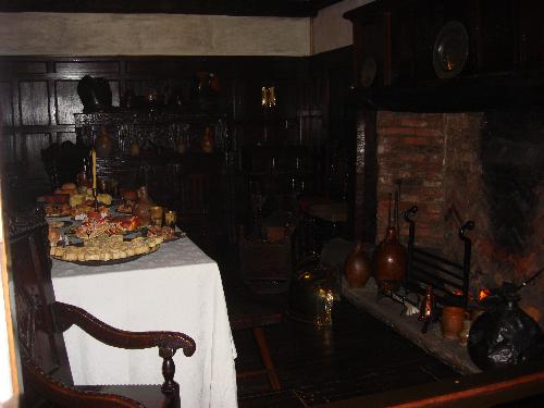 a dinning room of 17th century.  - The largest recreated room you will encounter is a dinning room of 17th century. It belonged to a prosperous family of the period. The family no longer ate with the servants in a communal hall as they had done in mediaeval house. The fireplace was moved to the side of the room; the beams, panelling and furniture are all made of oak, but have darkened considerably with age.