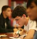 student - a boy sitting in the class room