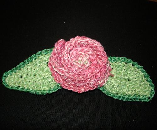 Pink Flower Bow - My hand crocheted Pink Flower bow with crocheted Green Leaves. Crocheted & sewn onto a French clip barrette.