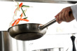 Professional chef - Chef hands with frying pan and professional