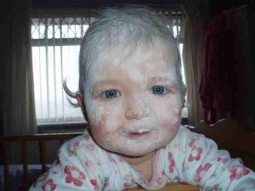 Talcum powder ghost! - This is my neice, Cassie, looking very pleased with herself for managing to empty that HAYOOGE bottle of talcum powder! I think she managed to catch most of it!