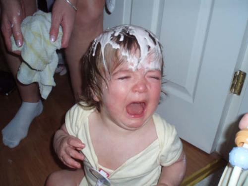 Baby (S)cream - This is my nephew, after his big sis had emptied a bottle (I think the FULL bottle!) of baby cream over his head. He was NOT amused! Lol!