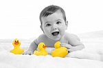 Baby with toys - This is the photo of the baby playing with toys.
