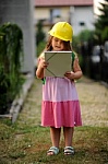 Young kid - This is the image of the young girl working as a building constructor.