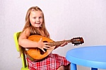 Girl with guitar - This is the photo of the girl playing a guitar