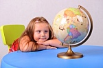 Child with globe - This is the photo of the girl viewing the globe.