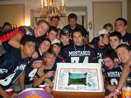 Team Dinner - Some of my favorite people showing off a cake that one of my favorite moms dropped off for our team dinner. Nobody did have the heart to cut through the photo part of the cake. It was returned intact to the mom.
