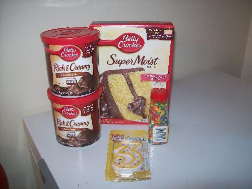 Cake Mix, Icing, Sprinkles, & Candle - Cake mix, icing, sprinkles and candle