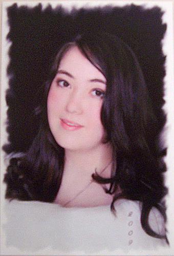 My Senior Picture - This picture was taken during my senior year of high school. It looks a little odd because when I scanned it onto the computer it was acting up, so I tried to un-blur it. Obviously it didn't work very well.