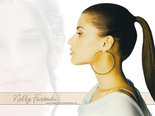 nelly furtado-wallpaper - nelly fortado in one of her best poses. she's beautiful.