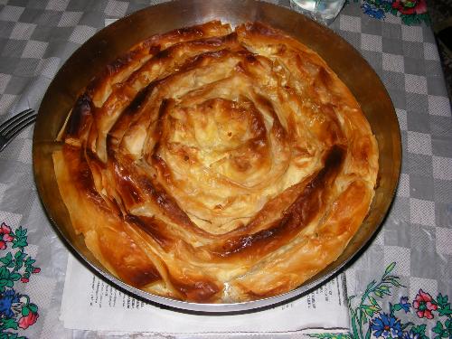 'Banitza' - A typical bulgarian meal made of dough, cheese, salt, eggs, and water. first the pastries are made, than they are filled wth cheese. and it's backed in oven at about 200 Degrees