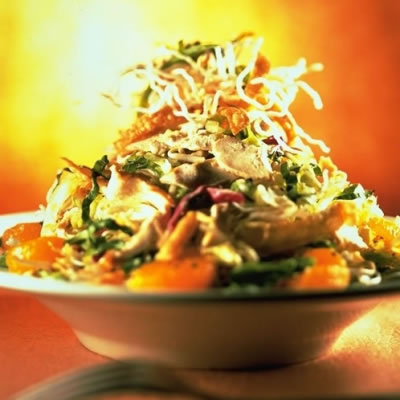 Chinese Chicken Salad - This is the photo of the chinese chicken salad. The ingredients are chinese stuff ,ginger , sesame oil , water chestnuts , deep fried noodles , mandarin orange slices , bamboo shoots , chinese mustard , nuts.