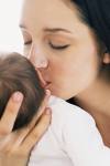 Mother - tHis is the photo of the mother kissing her infant with an innocent love.